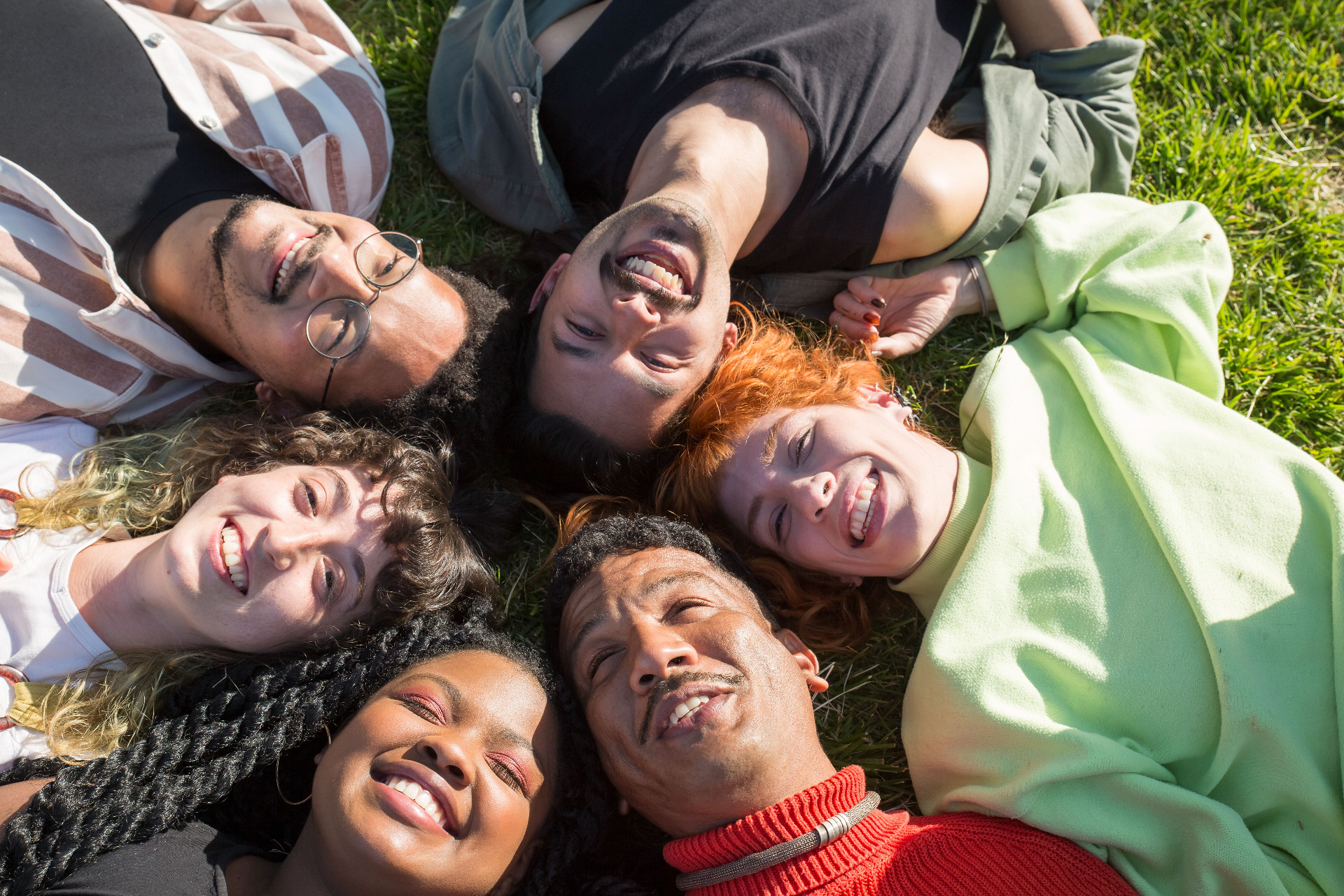 A diverse group of people smiling together